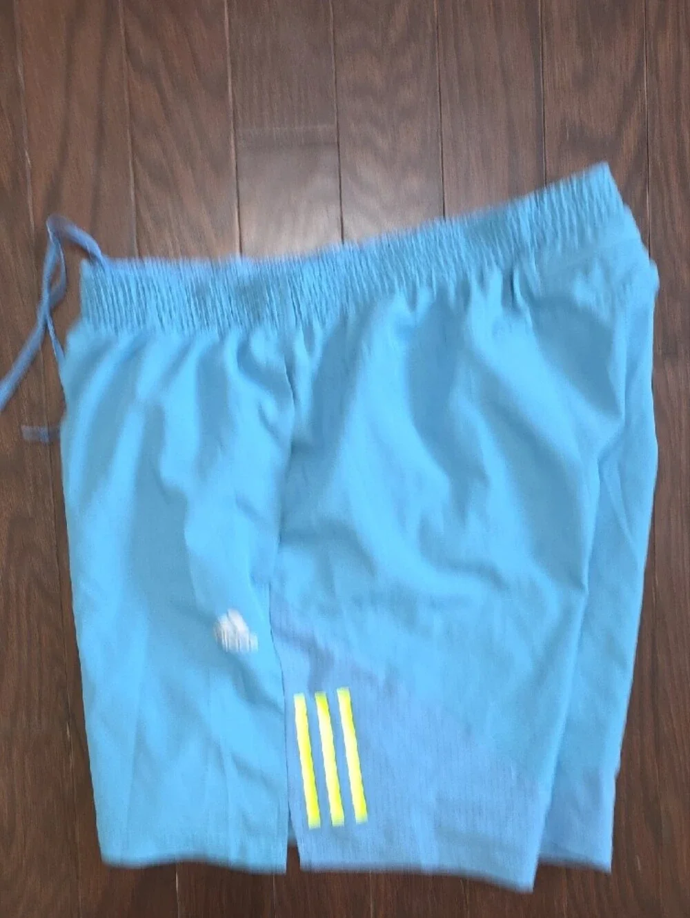 adidas Men's Light Blue Athletic Shorts with Yellow Accent